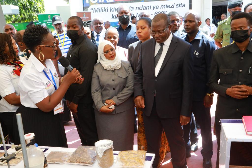 Vice President Hon. Dr. Philip Mpango and  Minister for Industry and Trade Hon. Dr. Ashatu Kijaji (MP) getting information on various TIRDO technologies 